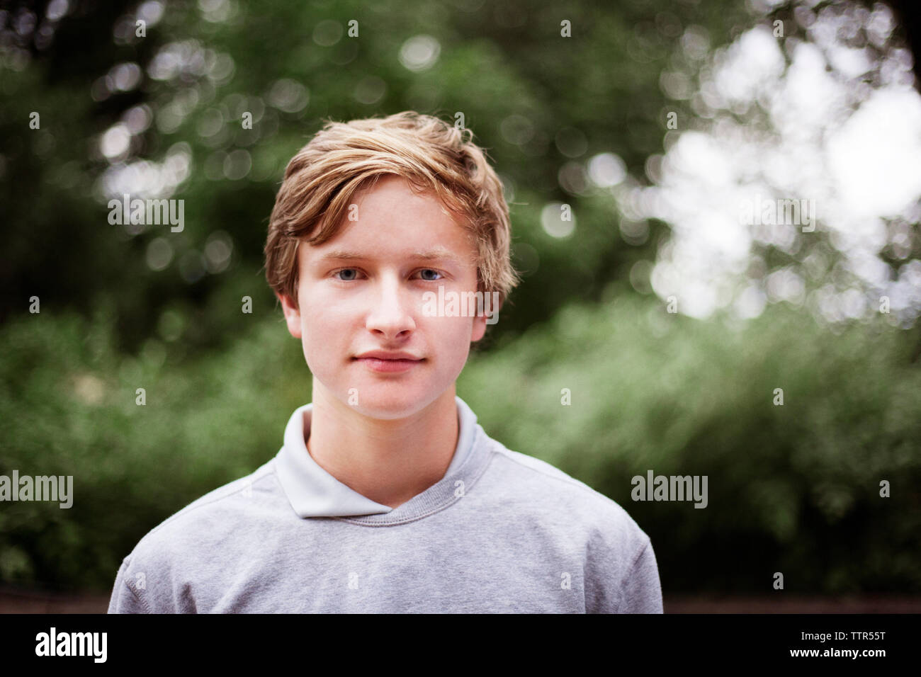 Teenage blond boy smiling hi-res stock photography and images - Alamy