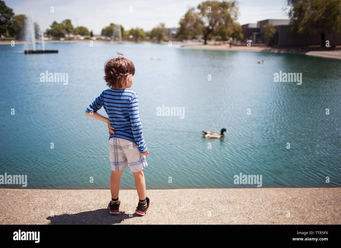 Boy standing rear view hi-res stock photography and images - Alamy