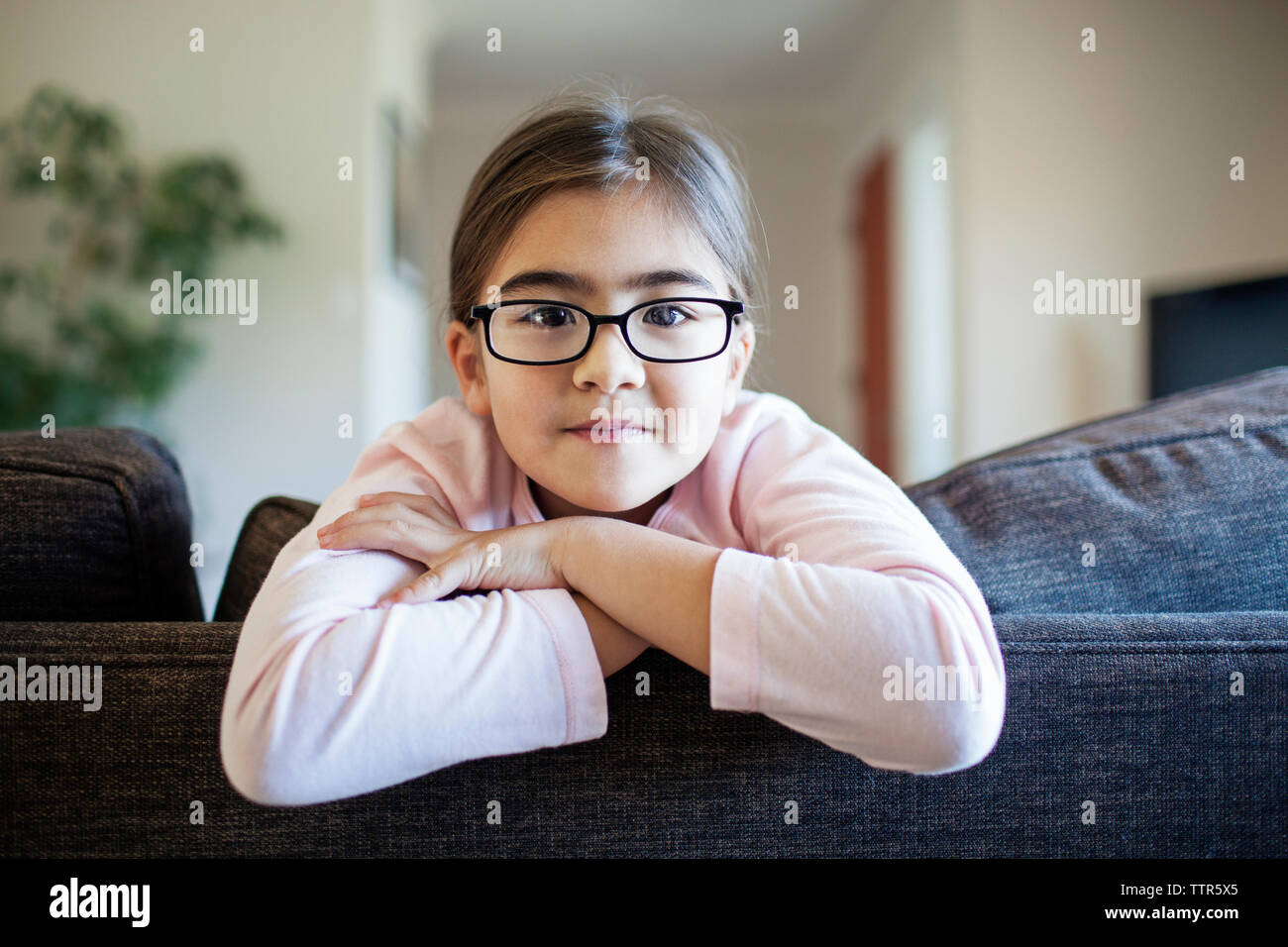 Portrait girl relaxing on sofa hi-res stock photography and images - Alamy