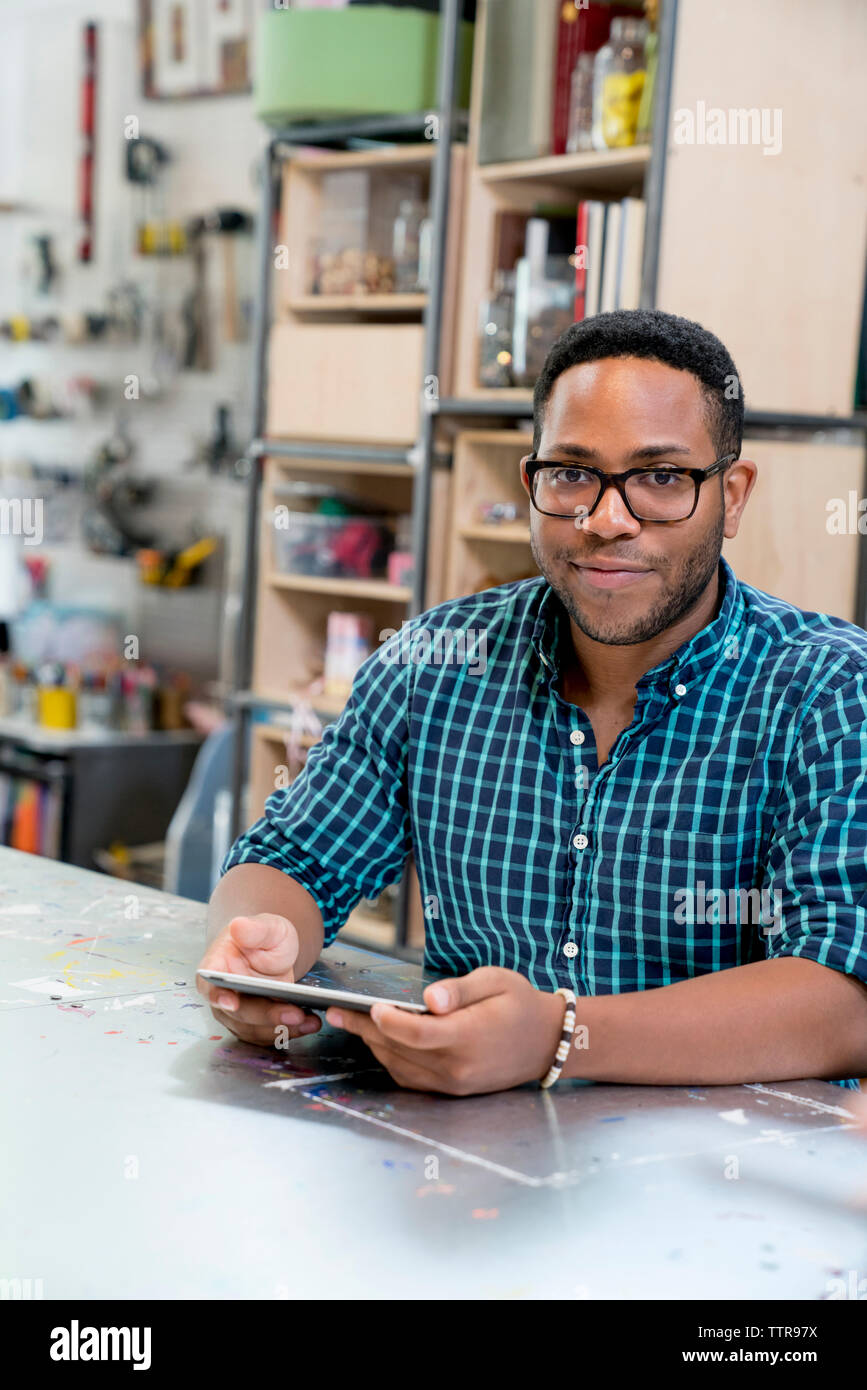 Portrait of confident businessman using tablet computer Stock Photo