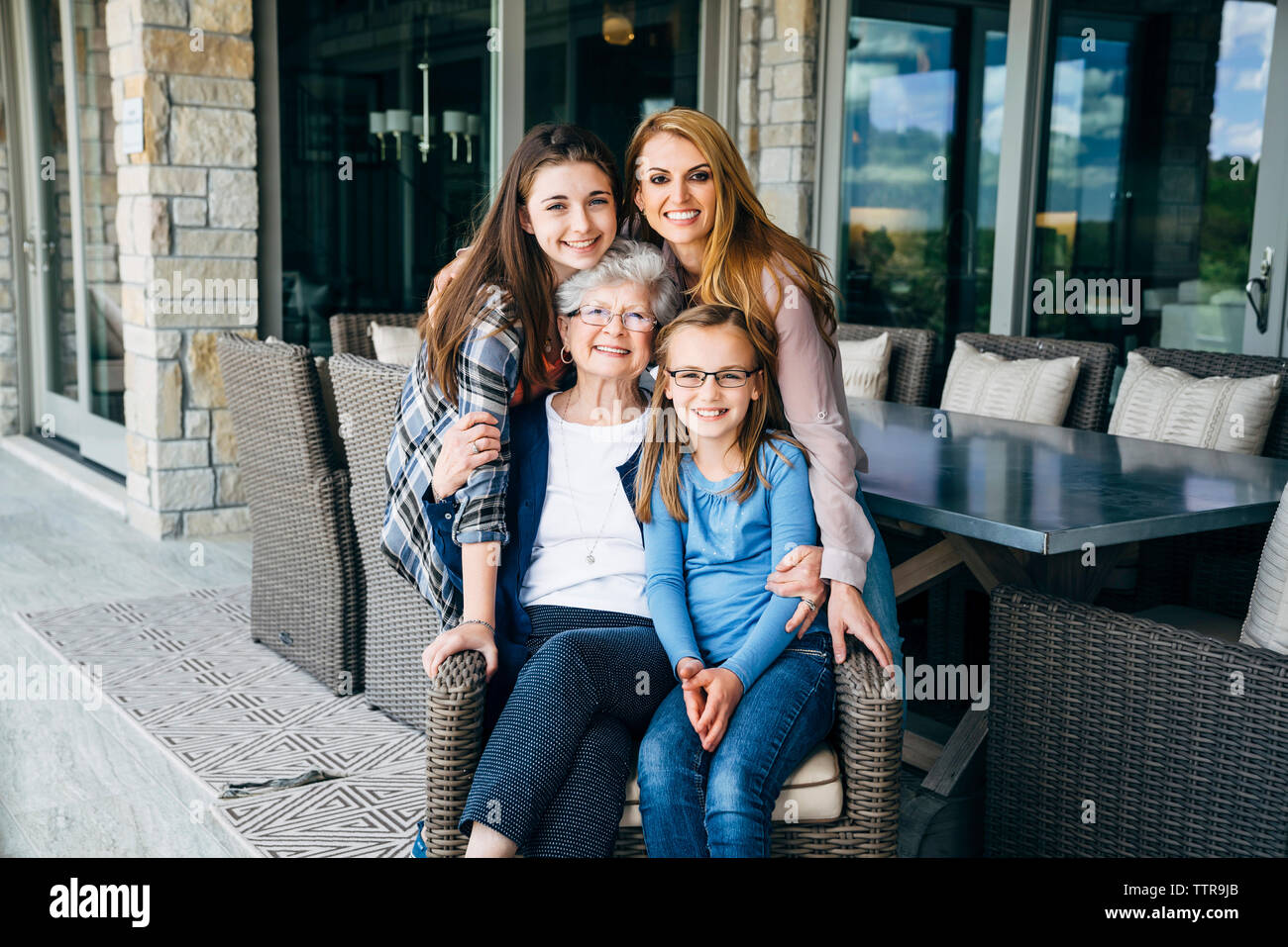 Family sitting on front porch hi-res stock photography and images - Alamy