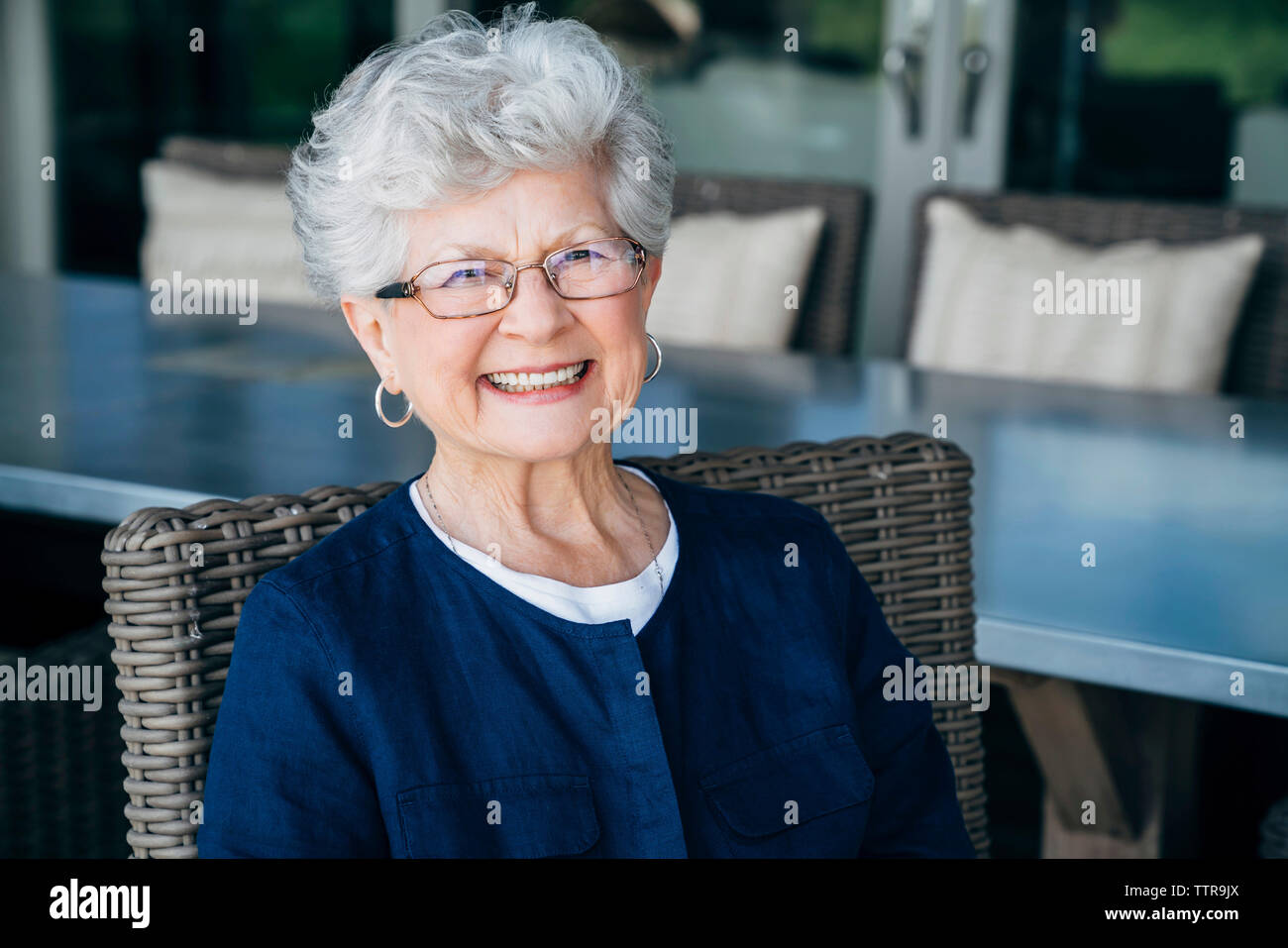 Woman sitting on her porch hi-res stock photography and images - Alamy