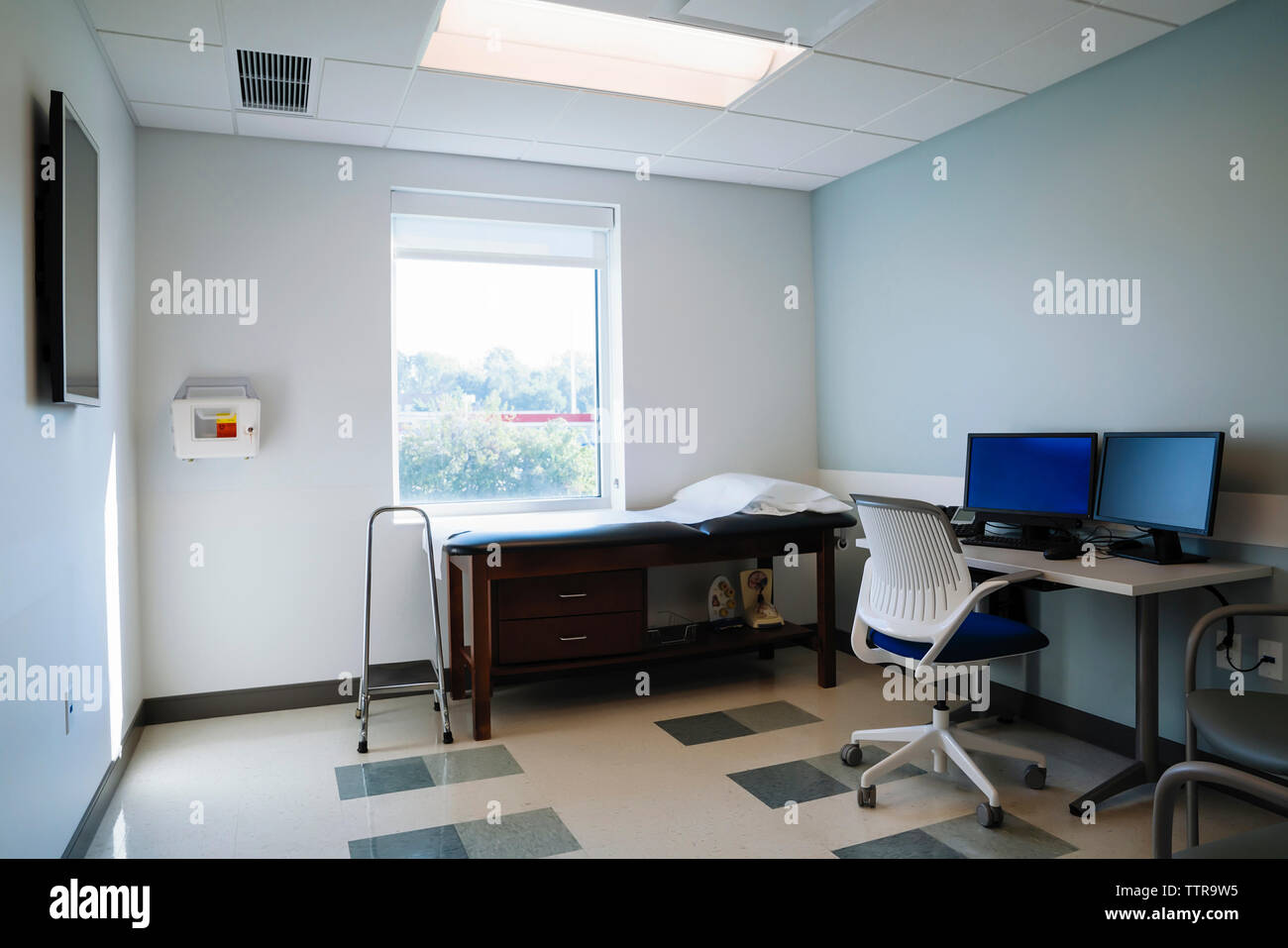 Desktop computers in medical examination room at hospital Stock Photo