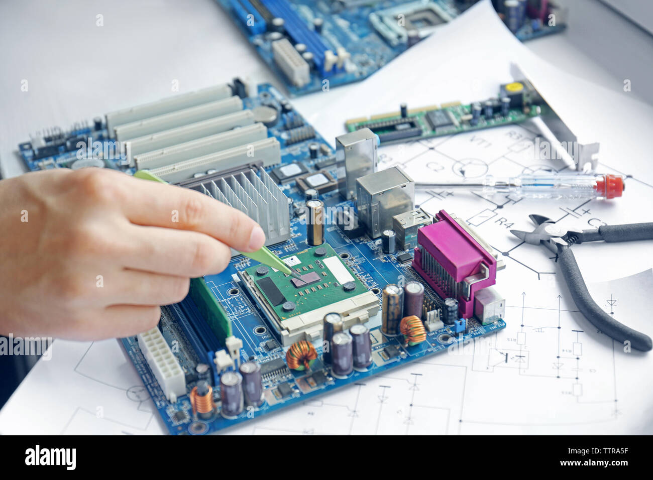 Man repairing mother board hi-res stock photography and images - Alamy
