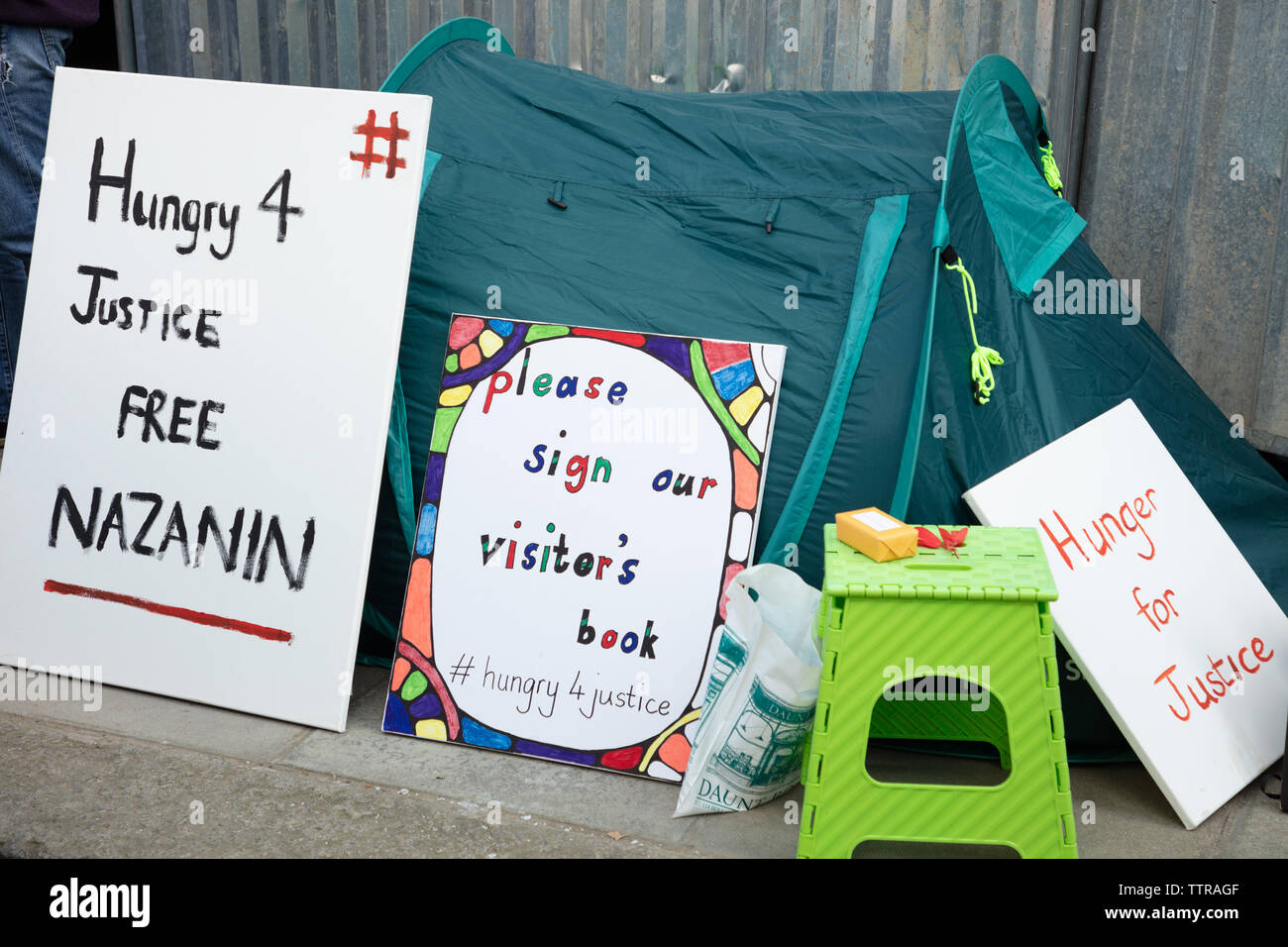 London, UK. 17th June 2019. Tent and placards in support of Richard Ratcliffe on hunger strike in front of the Iranian embassy in London in protest of the detention of his wife Nazanin Zaghari in Iran over spying allegations. Credit: Joe Kuis / Alamy Stock Photo
