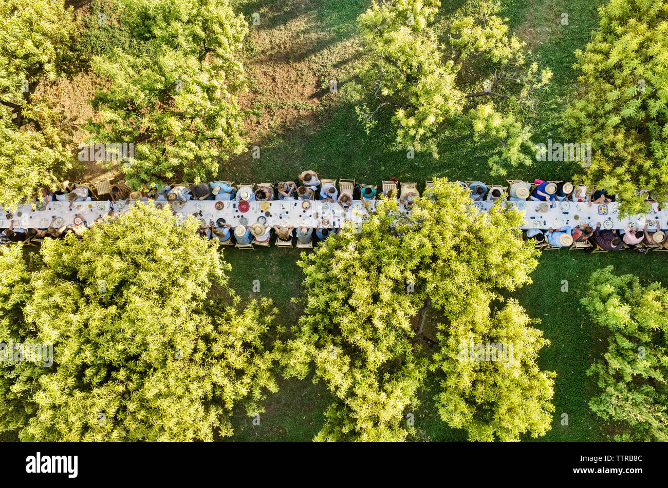 Overhead view of people having food at outdoor dining table Stock Photo