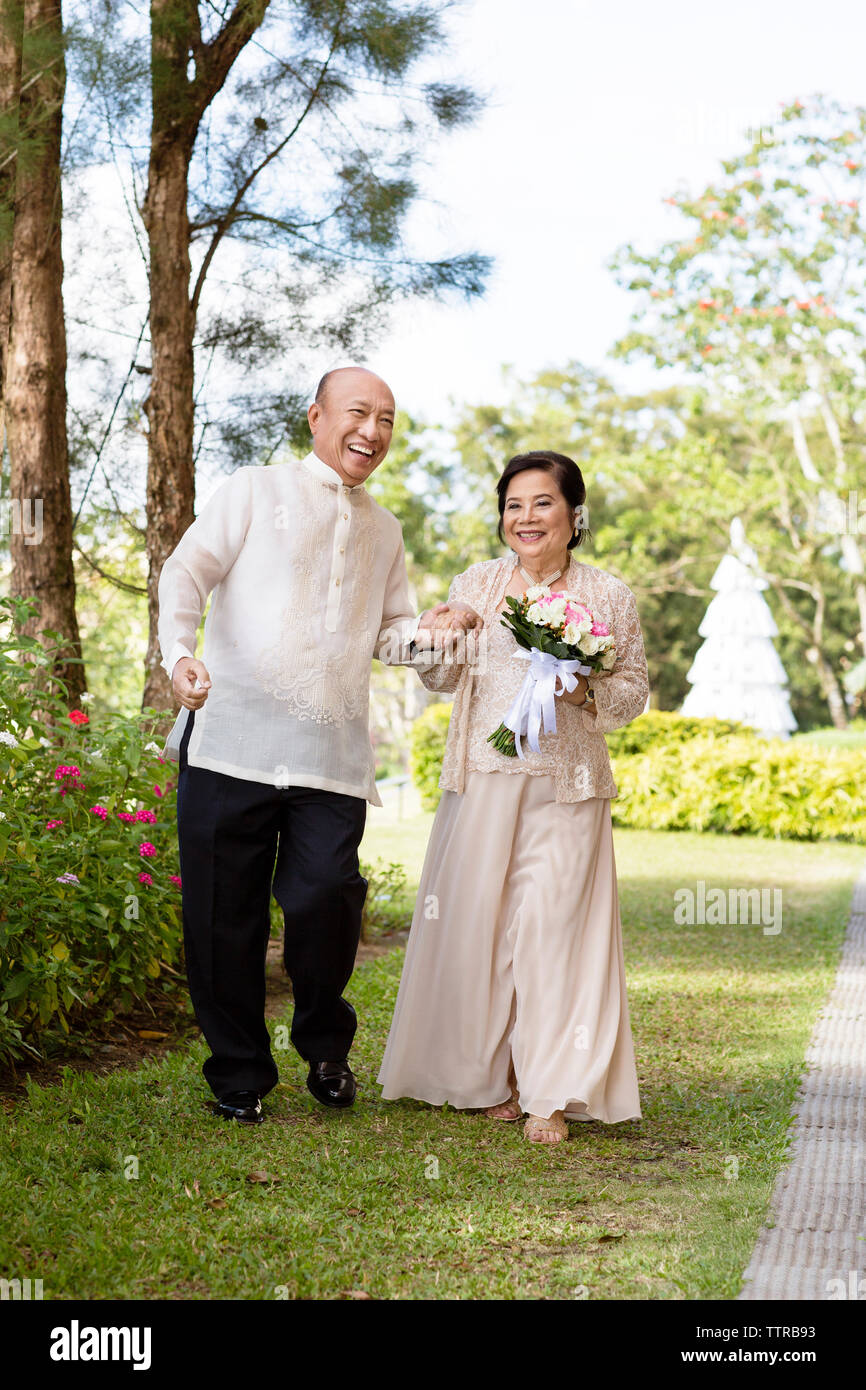 Happy senior couple at park Stock Photo