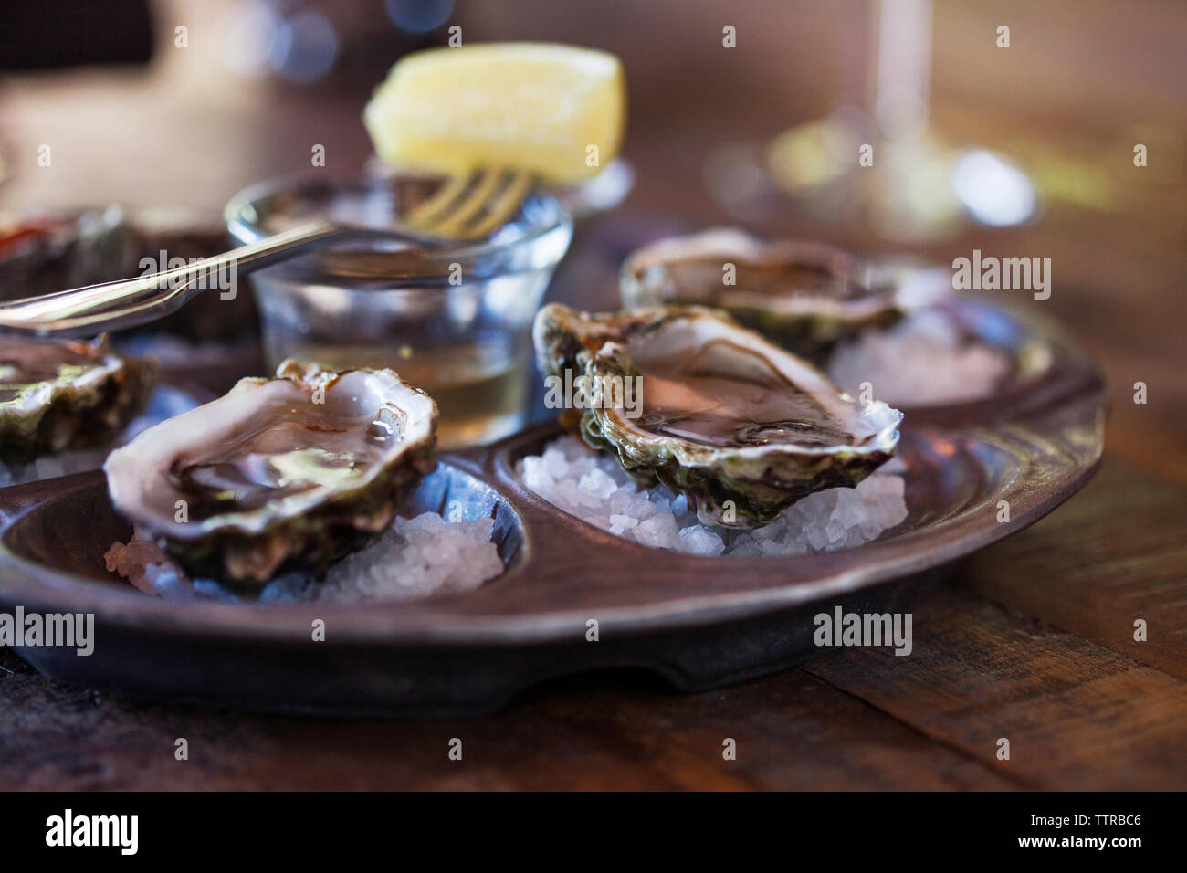 Oyster shells served on table Stock Photo