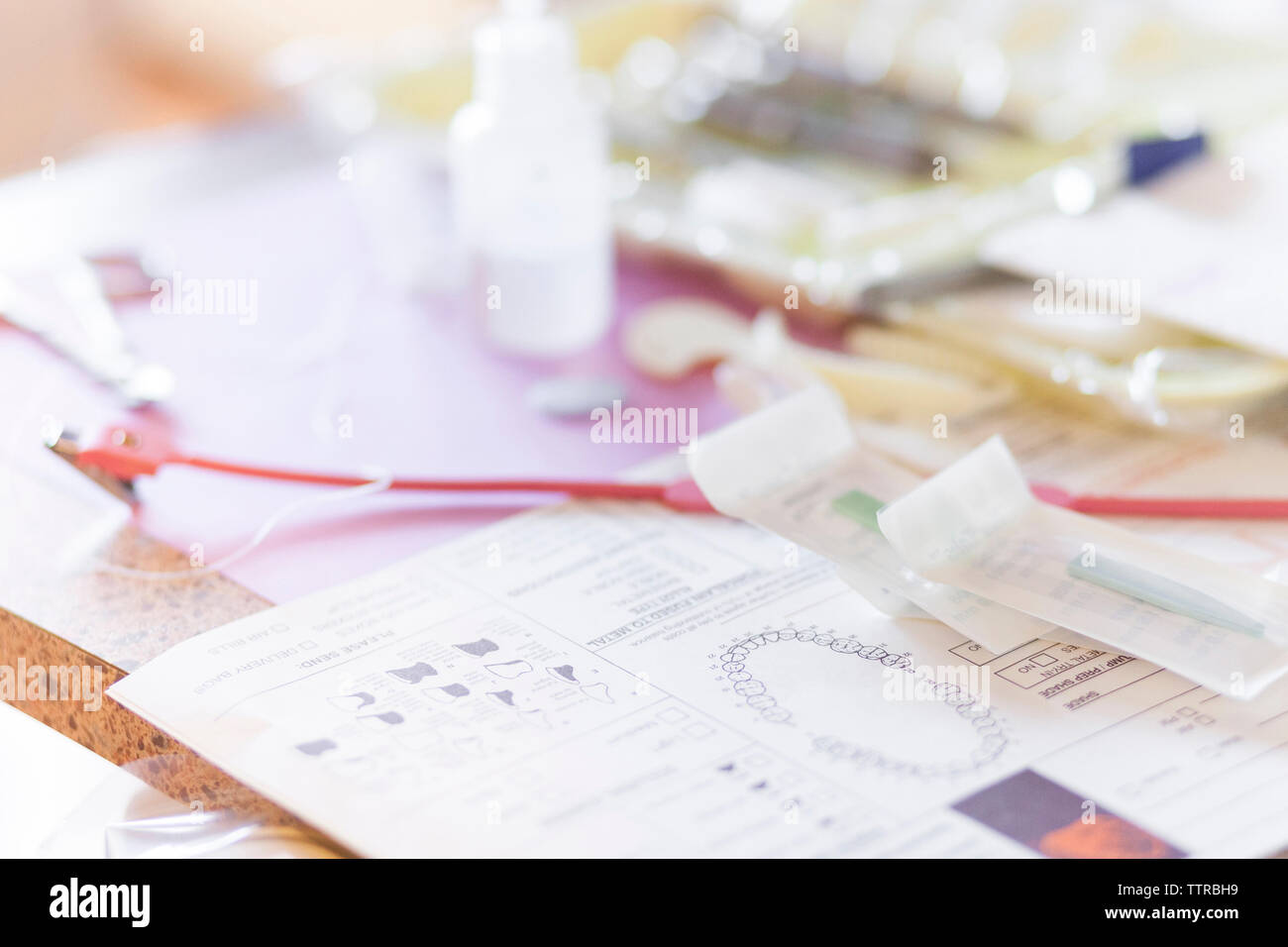 Close-up of medical report and equipment at dentist's office Stock Photo