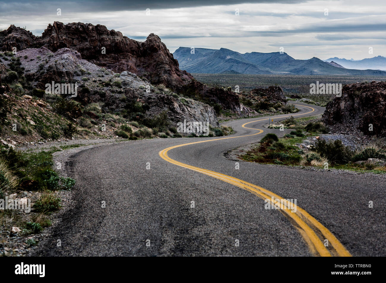 Road passing through rocks Stock Photo - Alamy