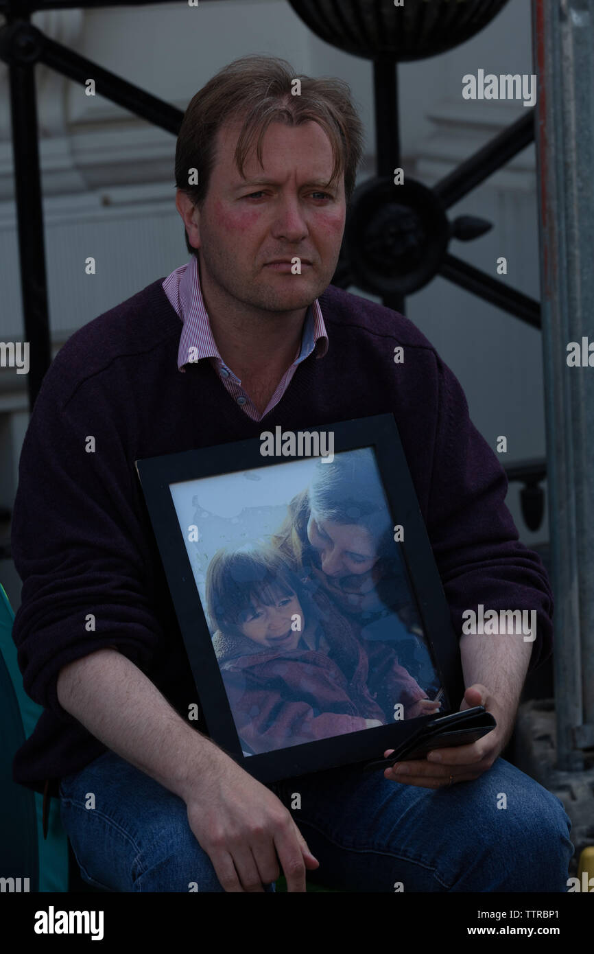 London, UK. 17th June 2019 Richard Ratcliffe on hunger strike in front of the Iranian embassy in London in protest of the detention of his wife Nazanin Zaghari in Iran over spying allegations, with a picture of his wife and five-year-old daughter. Credit: Joe Kuis / Alamy Stock Photo