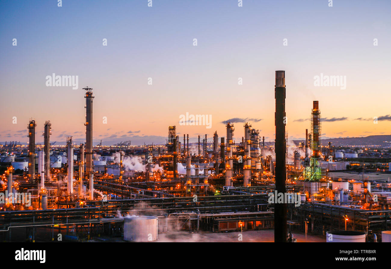 Illuminated industrial factory at sunset hi-res stock photography and ...