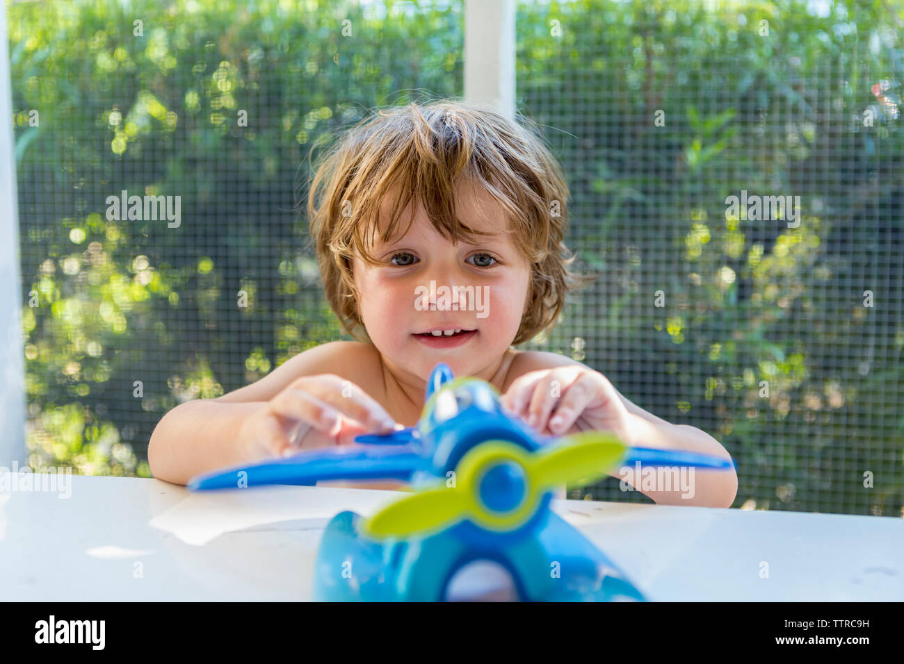 Cute child playing with toy at home Stock Photo