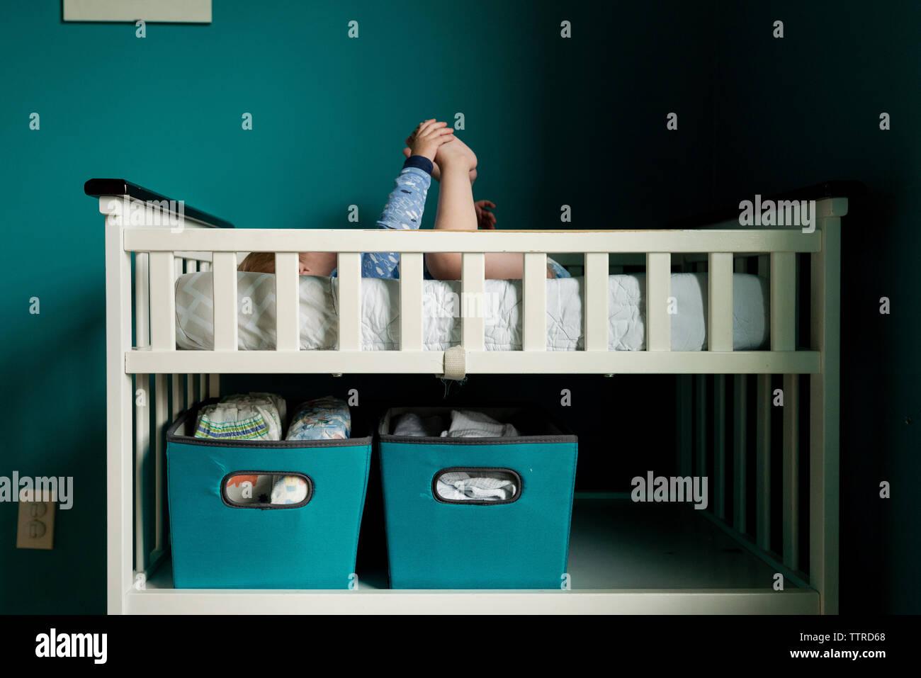 Side view of boy sleeping on bunkbed at home Stock Photo