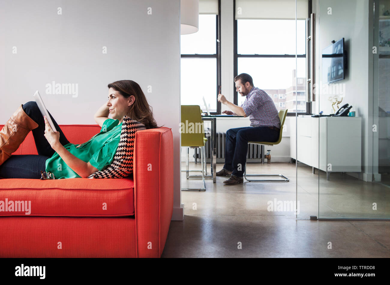 Side view of mature business people working in creative office Stock Photo