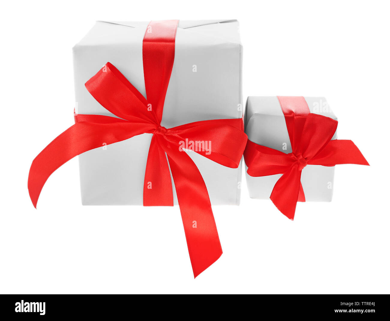 Gift boxes with red ribbon isolated on white Stock Photo - Alamy