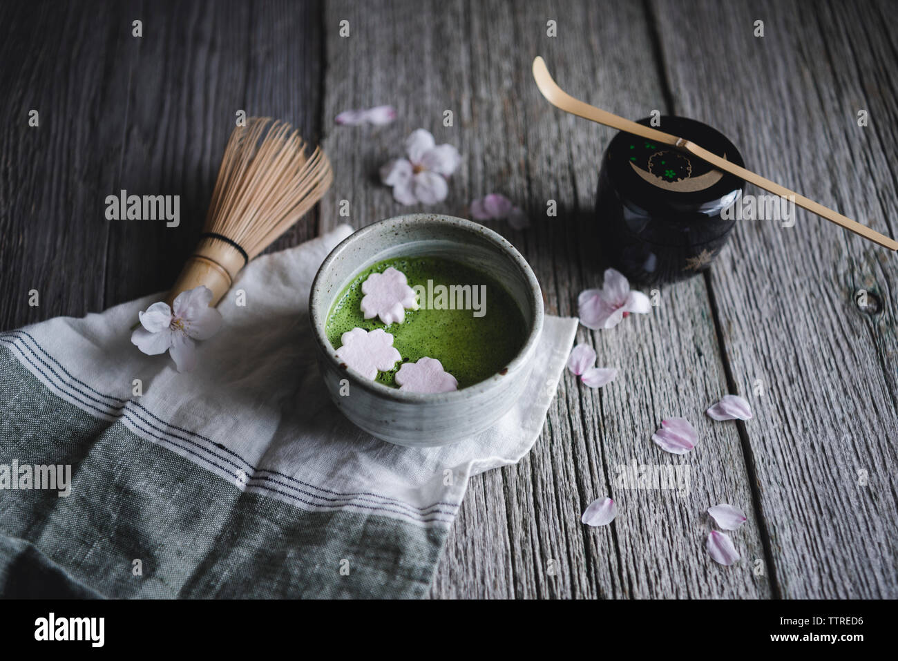 High angle view of Macha tea with marshmallows on wooden table Stock Photo