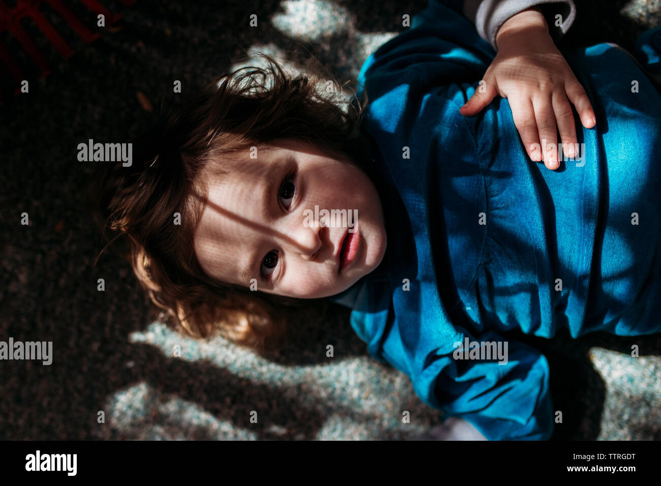 Girl lying on floor hi-res stock photography and images - Alamy