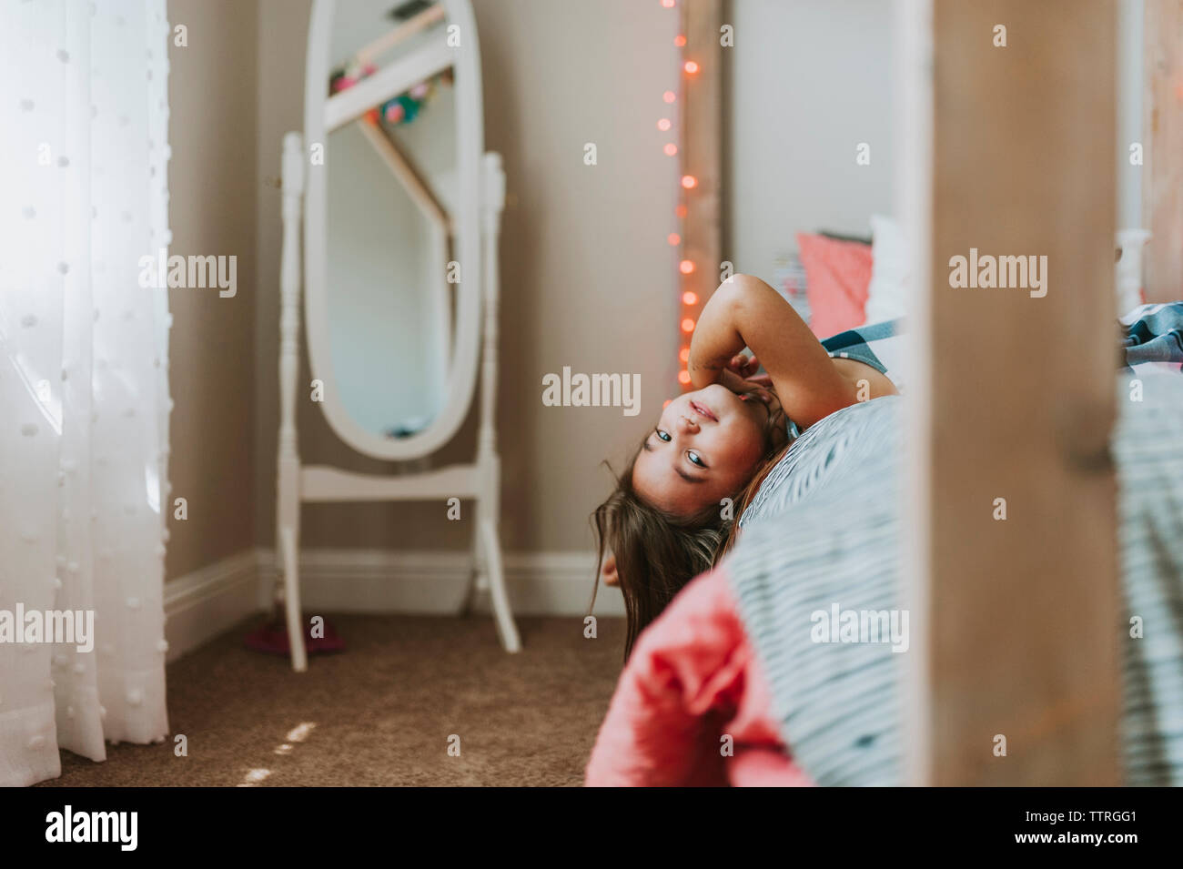 Portrait girl lying on bed hi-res stock photography and images - Alamy