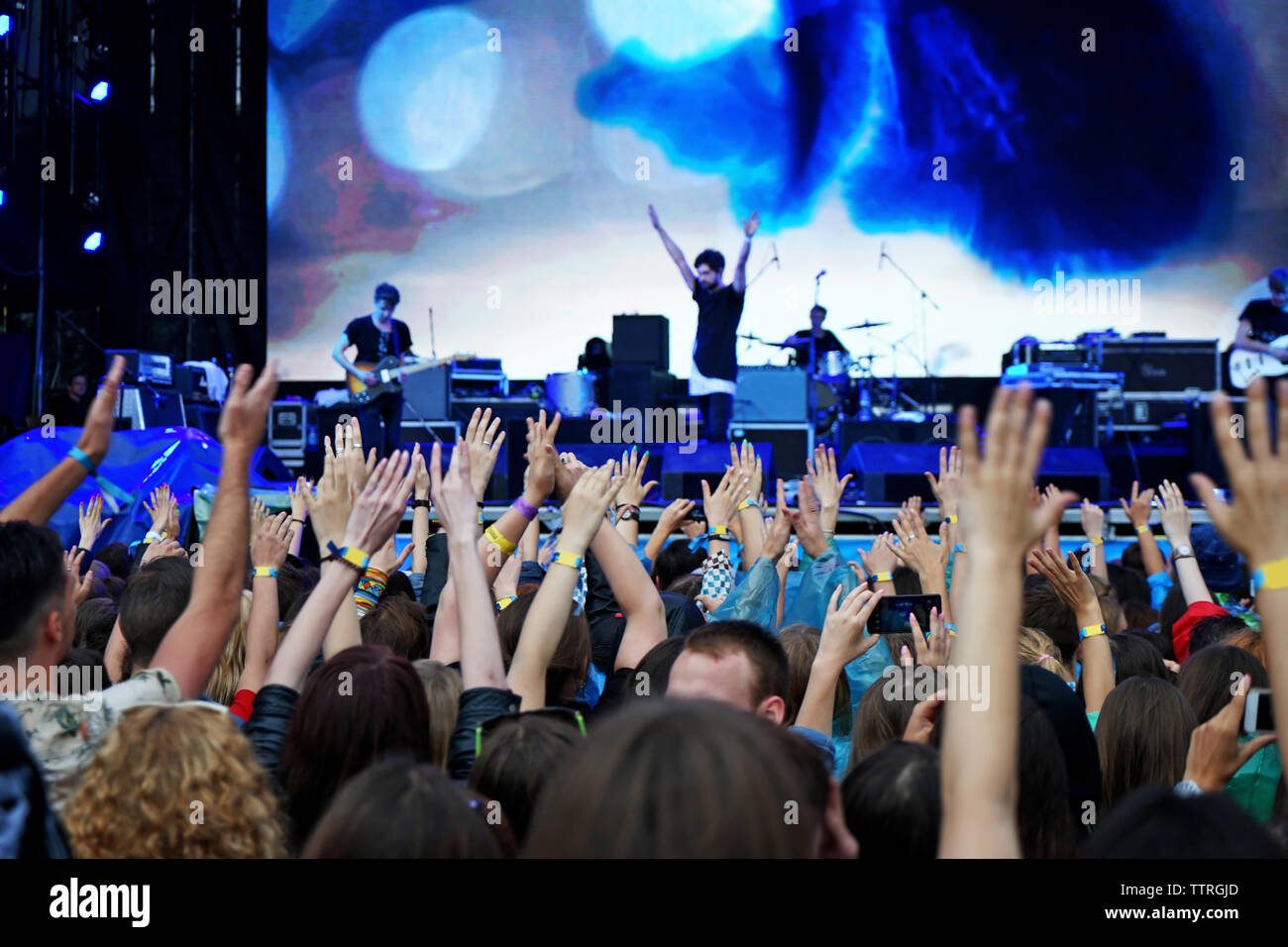 Crowd music fans waving hands hi-res stock photography and images - Alamy