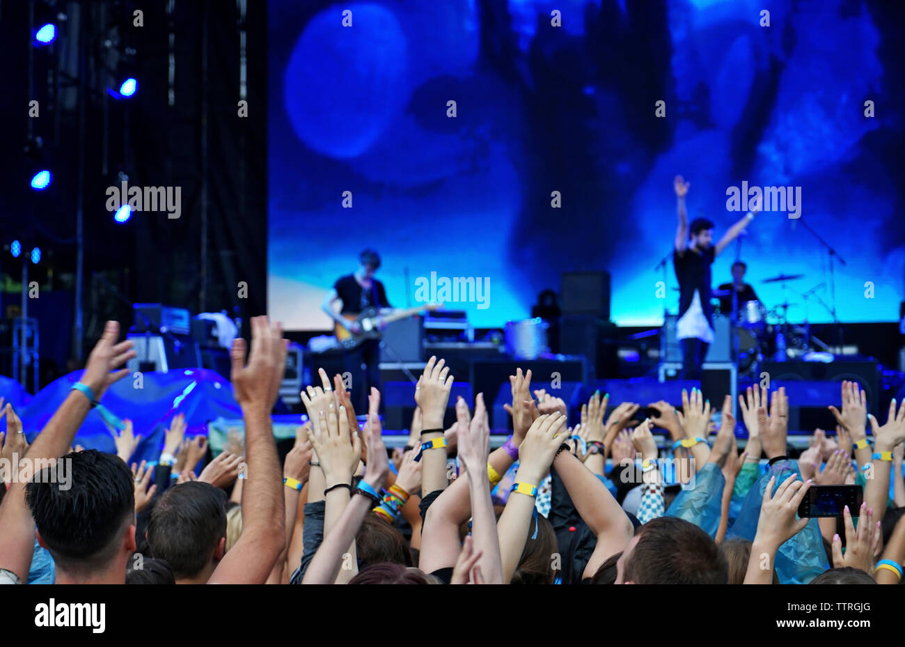 Crowd music fans waving hands hi-res stock photography and images - Alamy