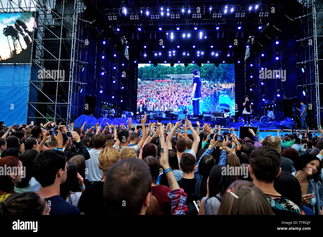 Crowd music fans waving hands hi-res stock photography and images - Alamy