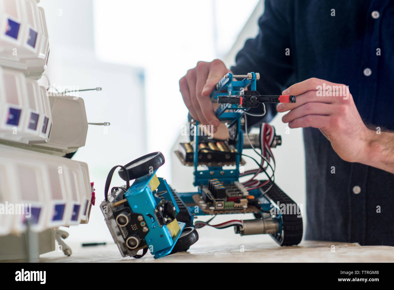 Midsection of engineer making drone in office Stock Photo