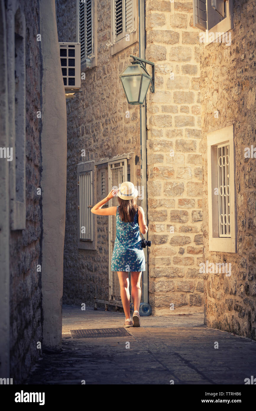 Woman walking city rear hi-res stock photography and images - Alamy