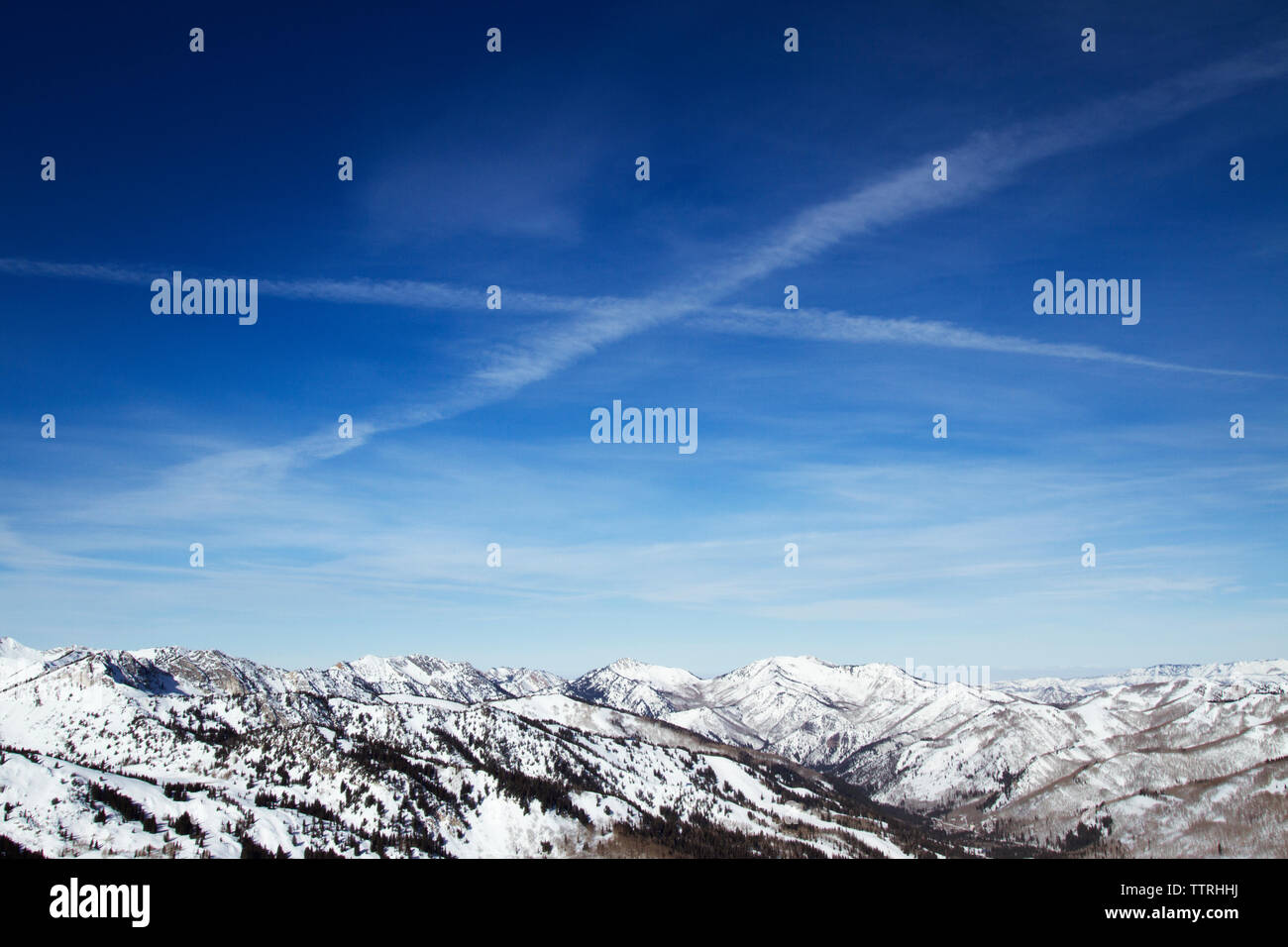 Scenic view of snow covered Wasatch Mountain range against sky Stock Photo