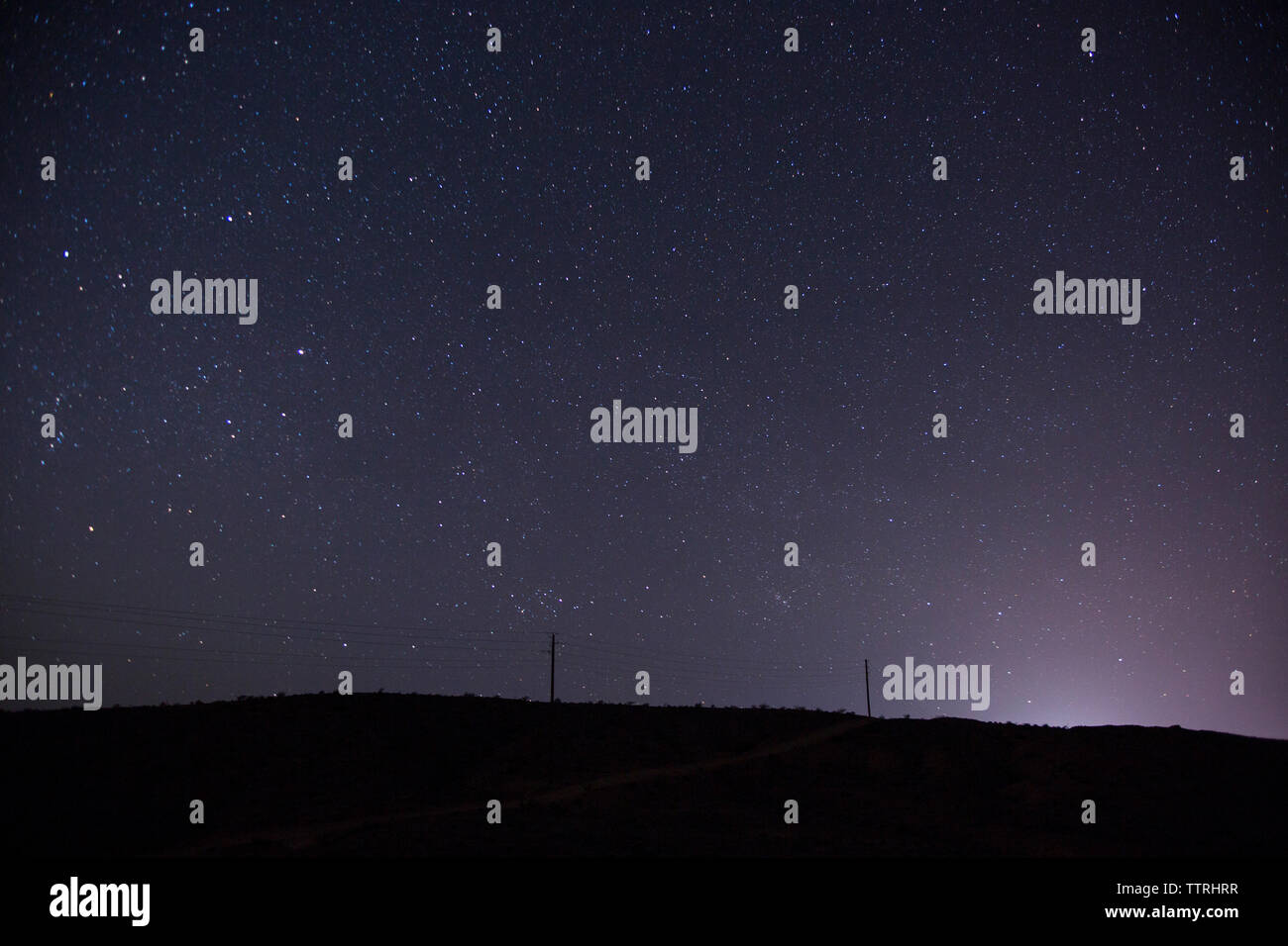 Low angle view of silhouette mountain against star field at night Stock ...