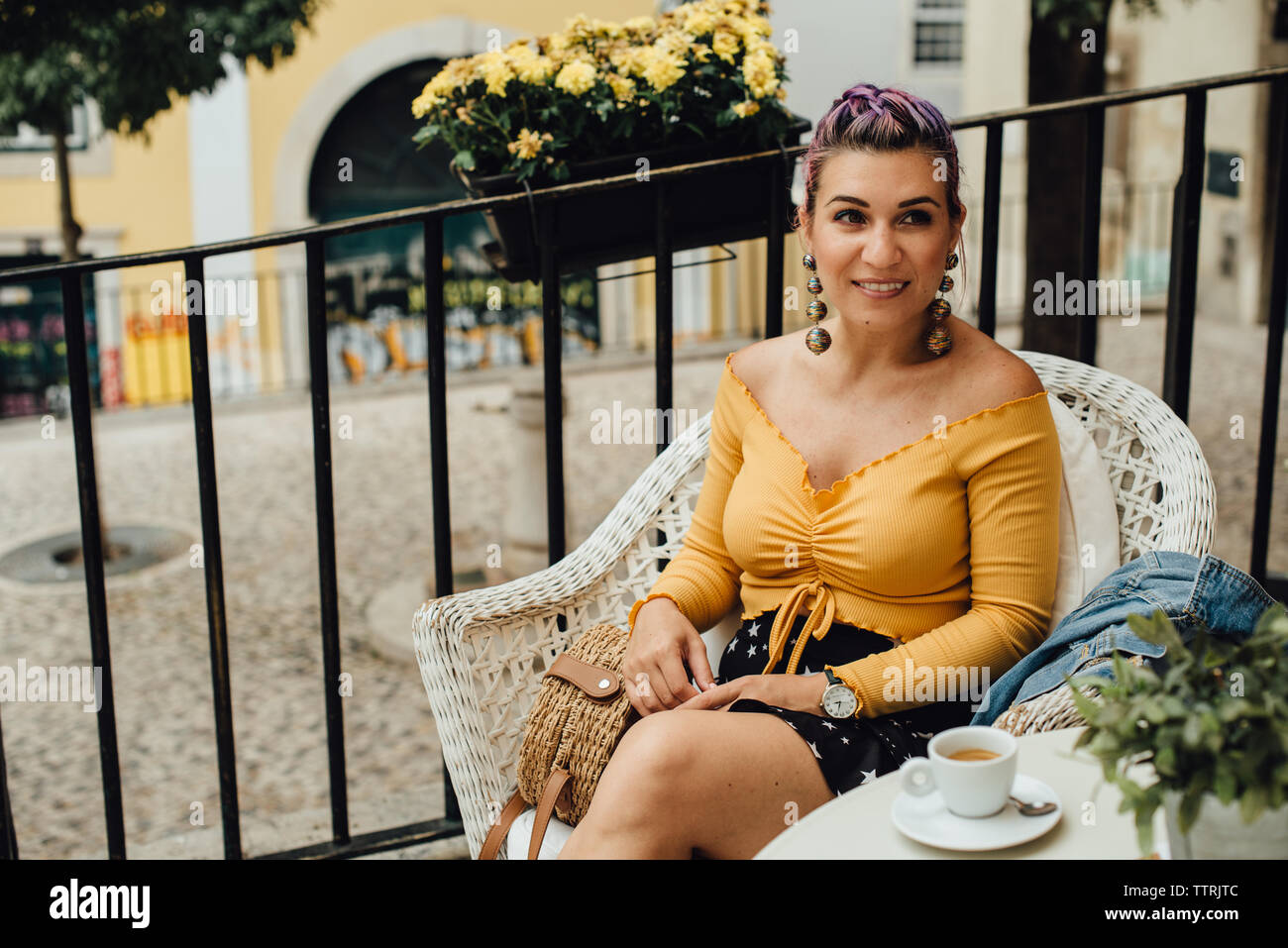 Girl with a cup of coffee in the street of Lisbon, Portugal Stock Photo