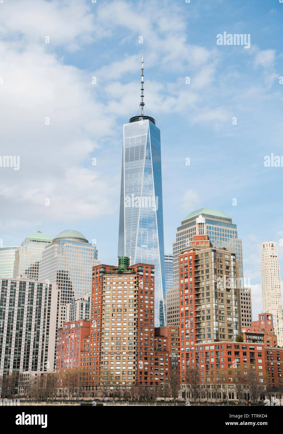 Low angle view of One World Trade Center by buildings against sky in city Stock Photo