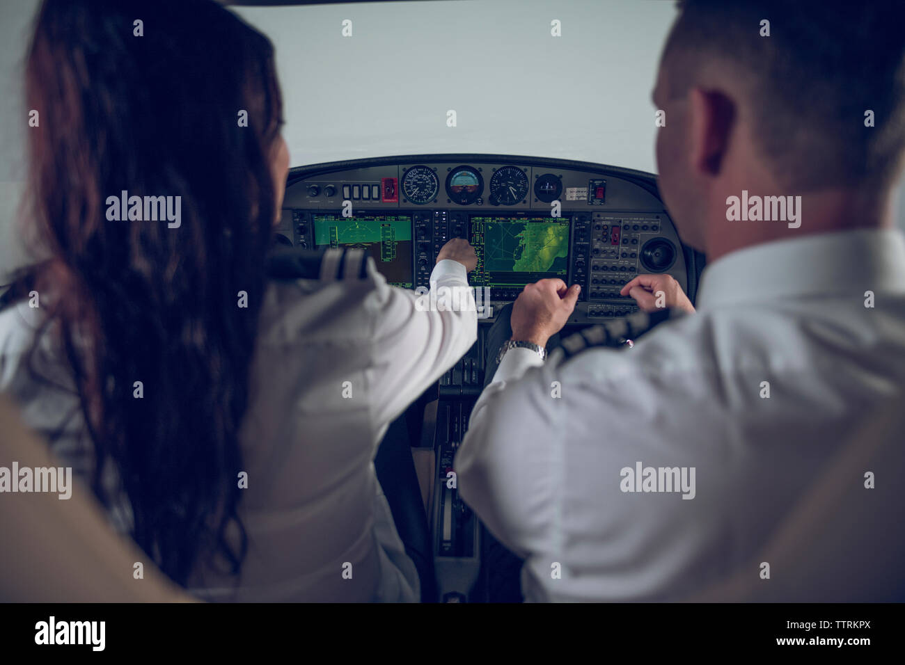 Male and female pilots cockpit hi-res stock photography and images - Alamy