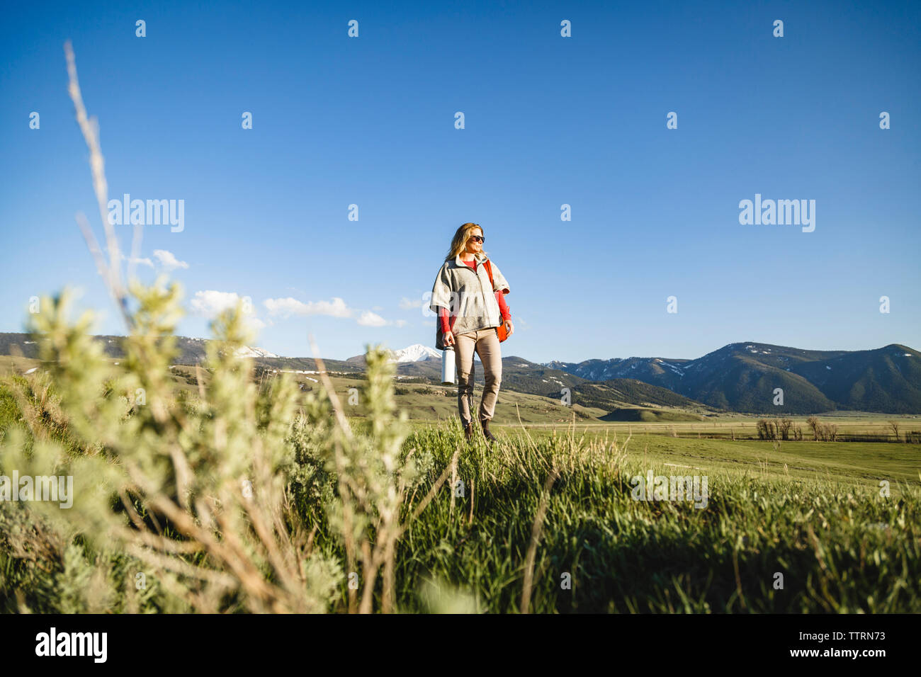 Old woman grass walking mountains hi-res stock photography and images ...