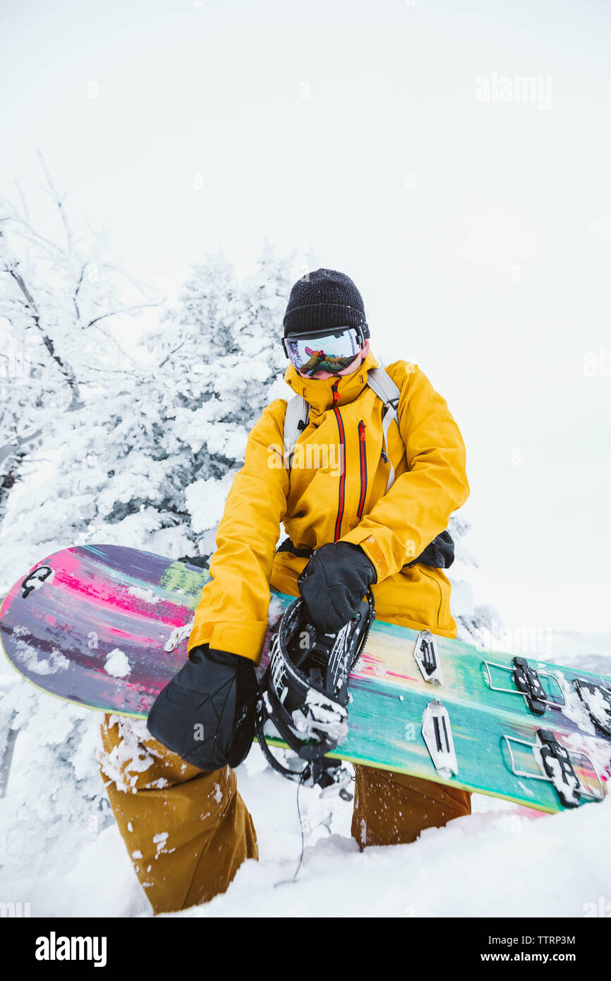 snowboarder puts together his splitboard getting ready to shred Stock Photo