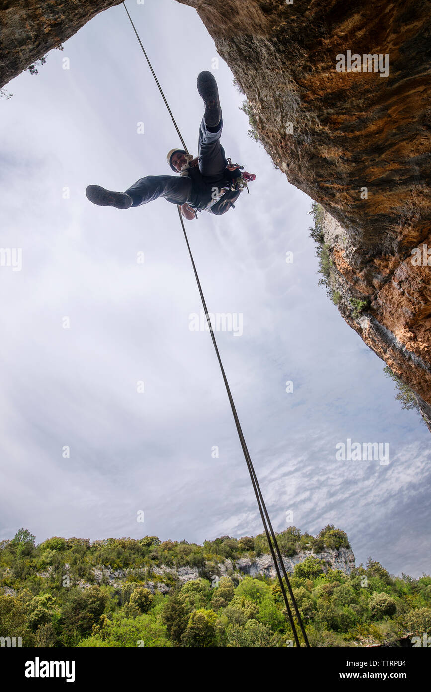 Man rappelling rock formation adventure hi-res stock photography and ...