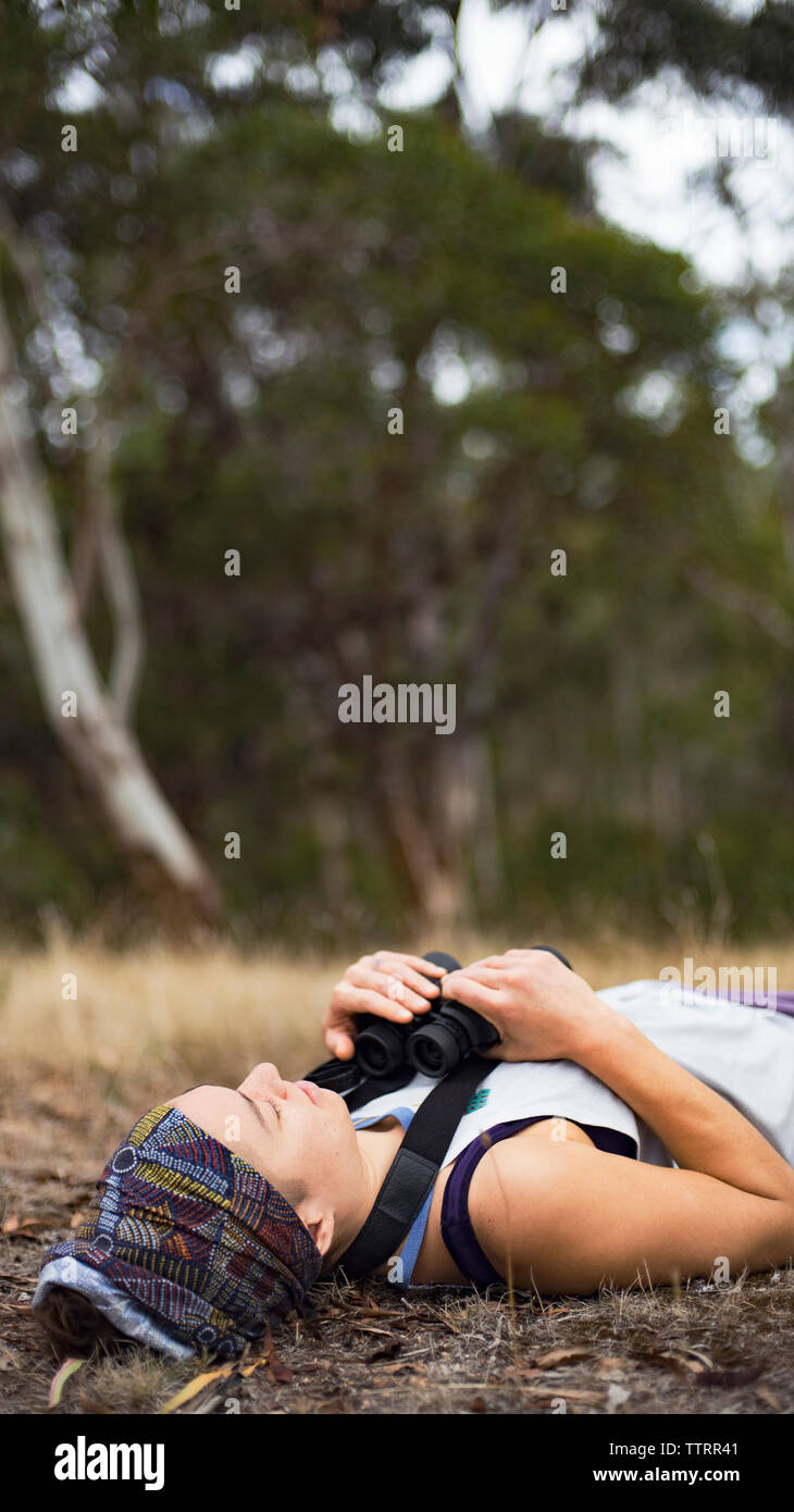 Woman binoculars lying hi-res stock photography and images - Alamy