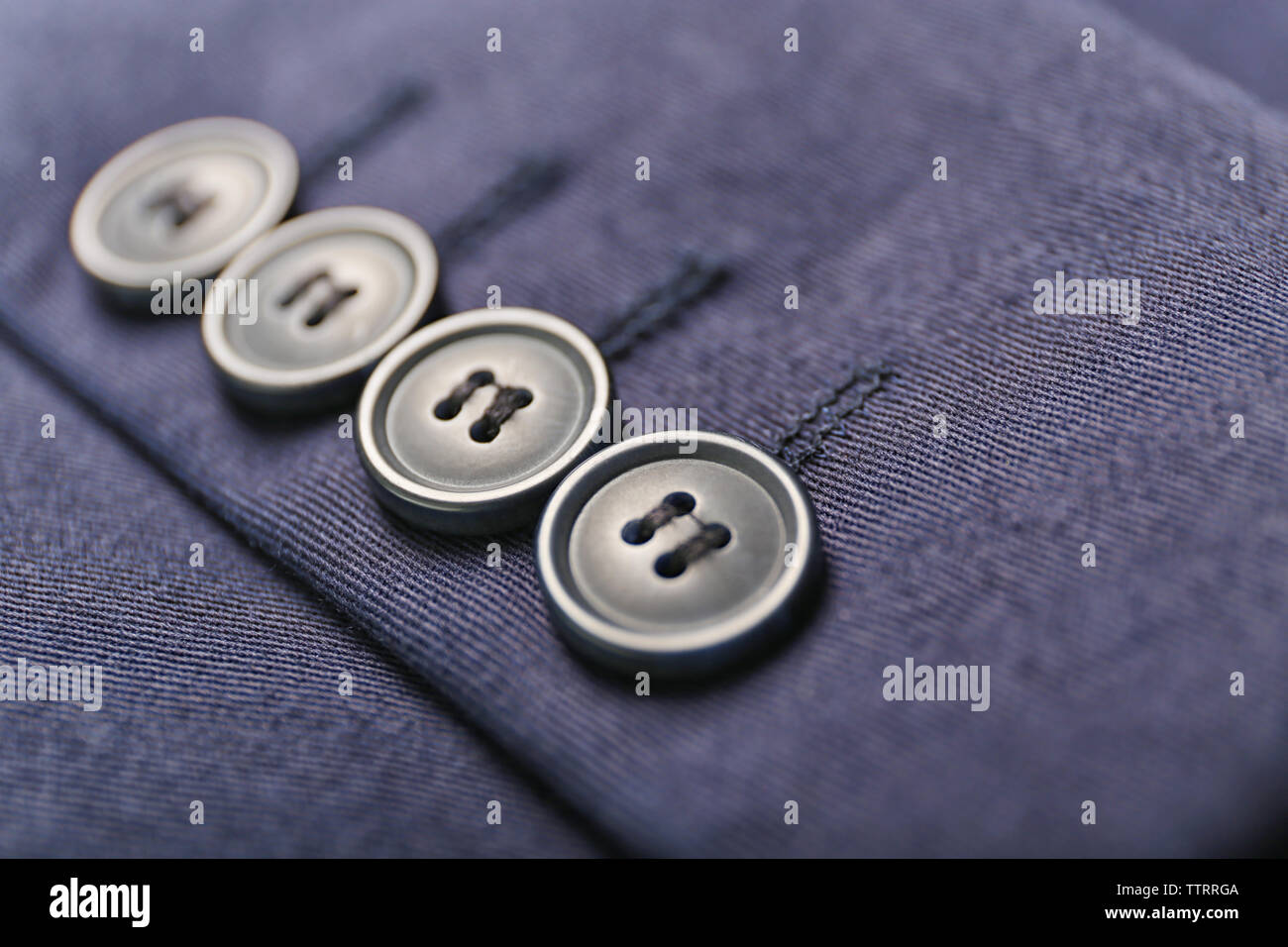 Buttons on clothes, close up Stock Photo - Alamy