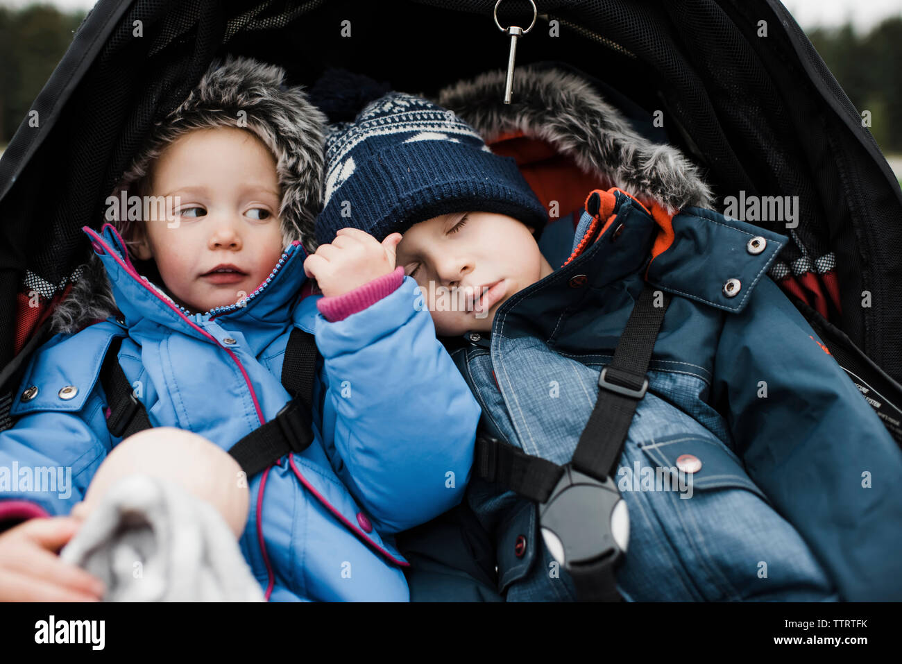 Sleeping baby girl in stroller hi-res stock photography and images - Alamy