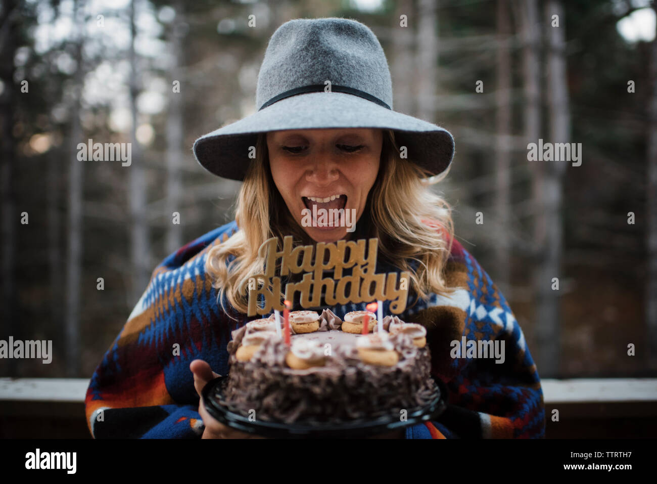 Old woman holding birthday cake hi-res stock photography and images - Alamy