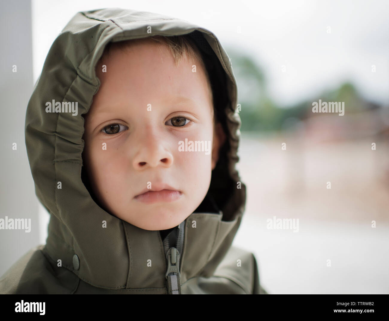 Boy wearing raincoat hires stock photography and images Alamy