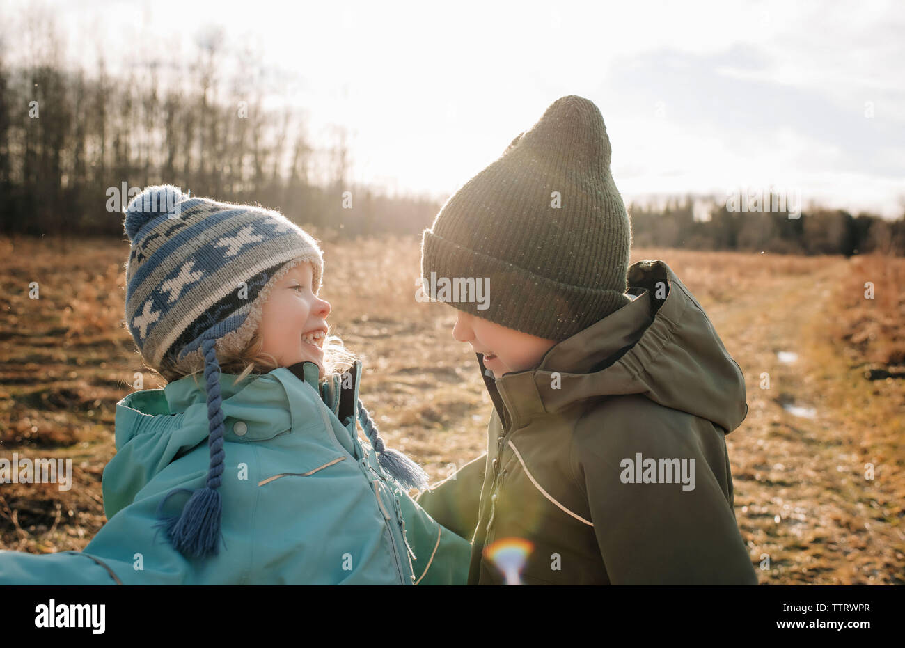 brother and sister having fun laughing, siblings laughing playing Stock Photo