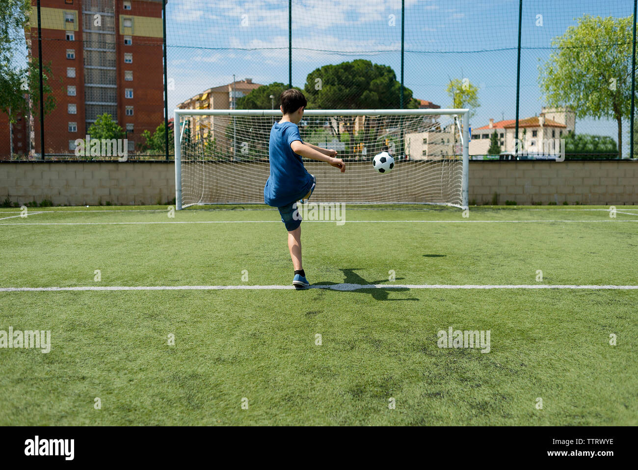 Child Kicking Ball Into Soccer Net High Resolution Stock Photography And Images Alamy