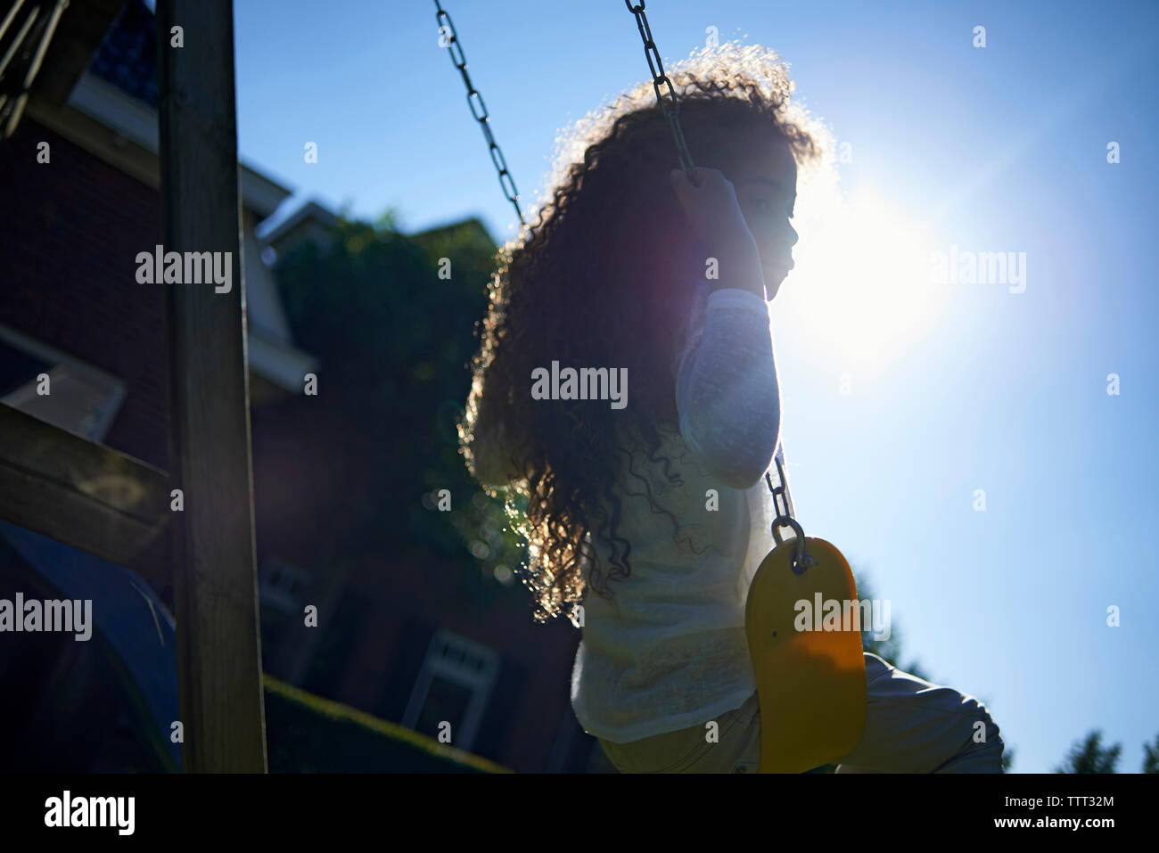 Girl swinging in hi-res stock photography and images - Alamy