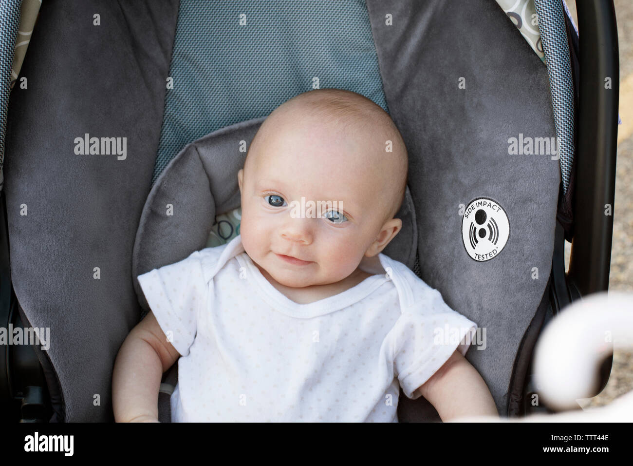 High angle portrait of baby resting in baby stroller Stock Photo