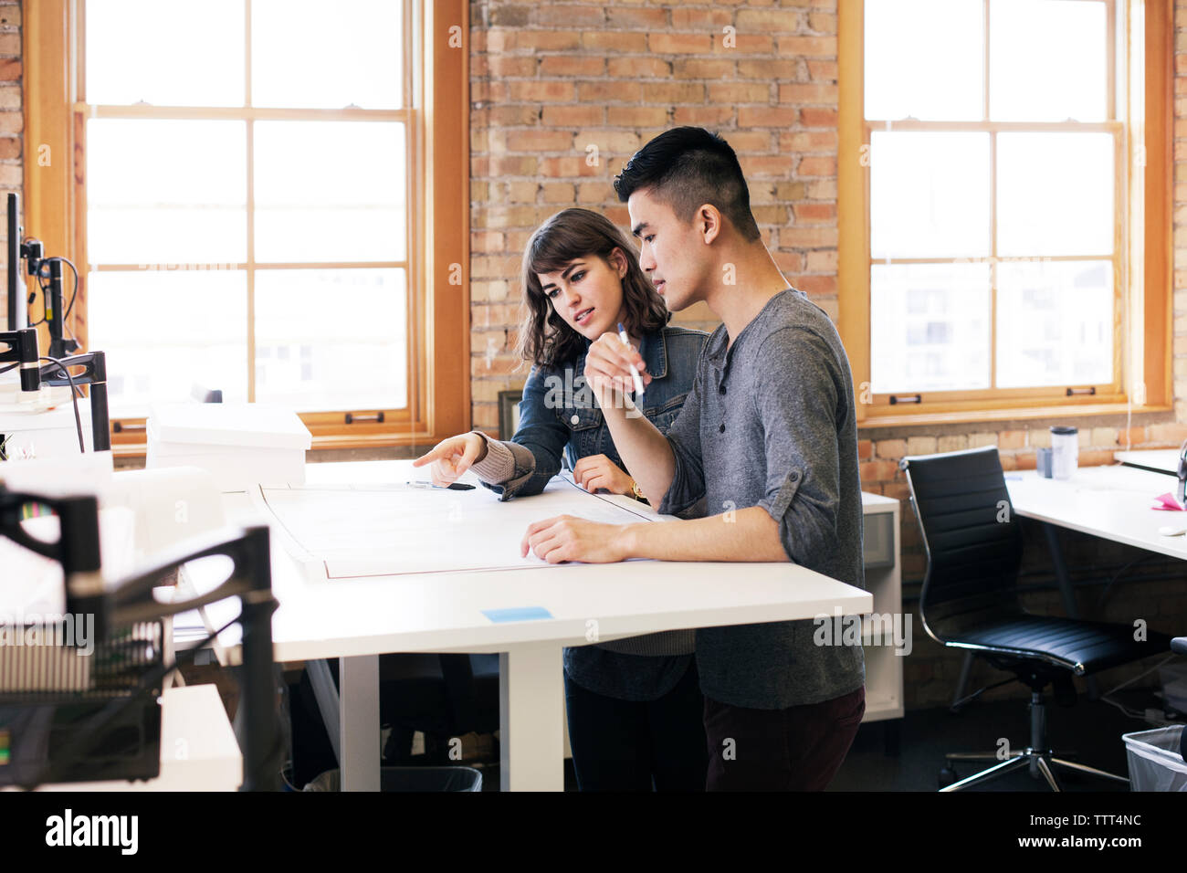 business people discussing plan while working in office Stock Photo