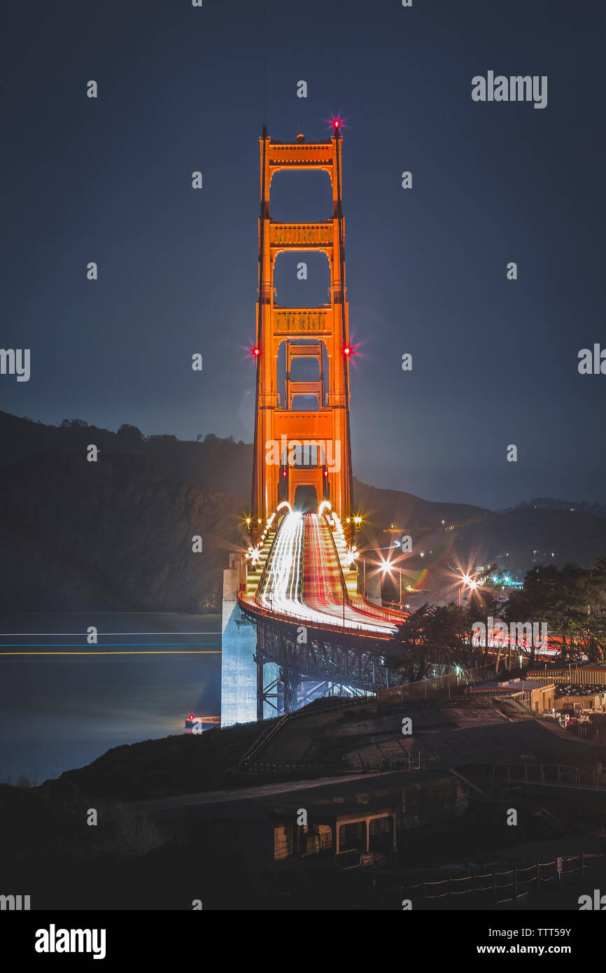 Light trails on Golden Gate Bridge against sky at dusk Stock Photo - Alamy