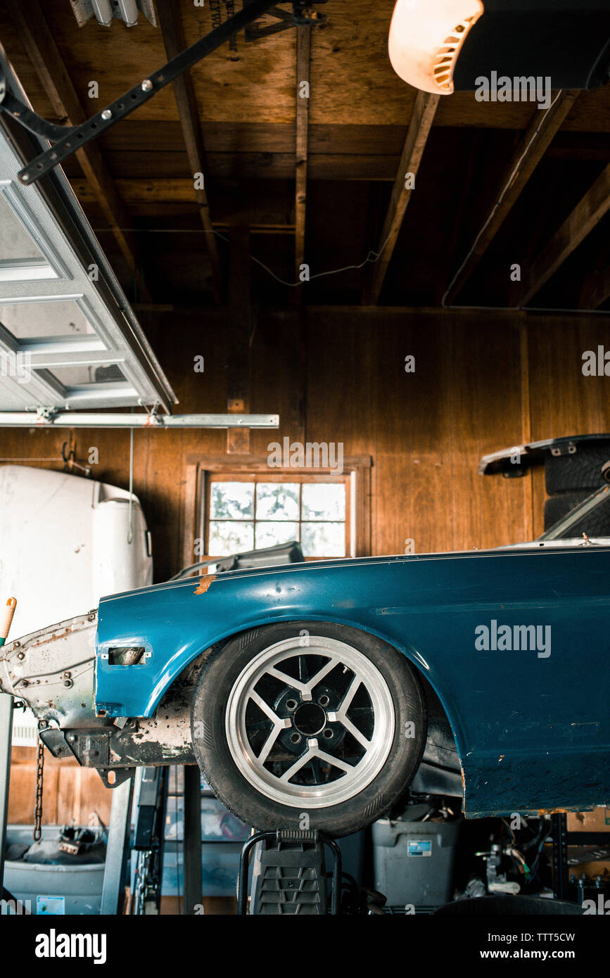 Vintage Auto Repair High Resolution Stock Photography and Images - Car In Auto Repair Shop TTT5CW