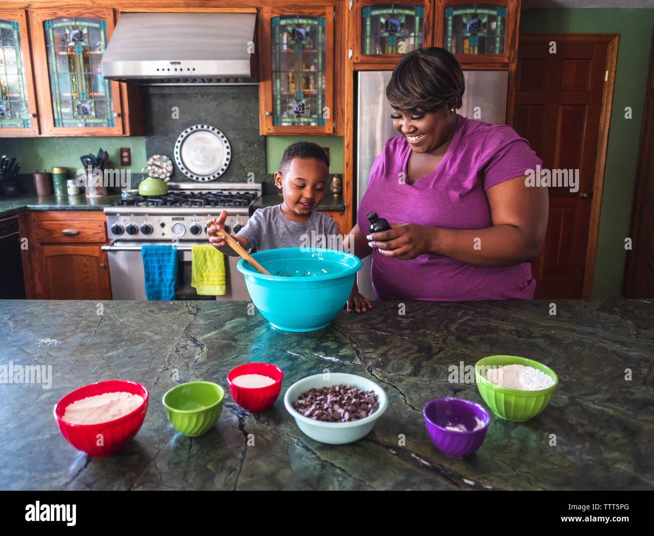 Mother and son baking cookies in the kitchen Stock Photo