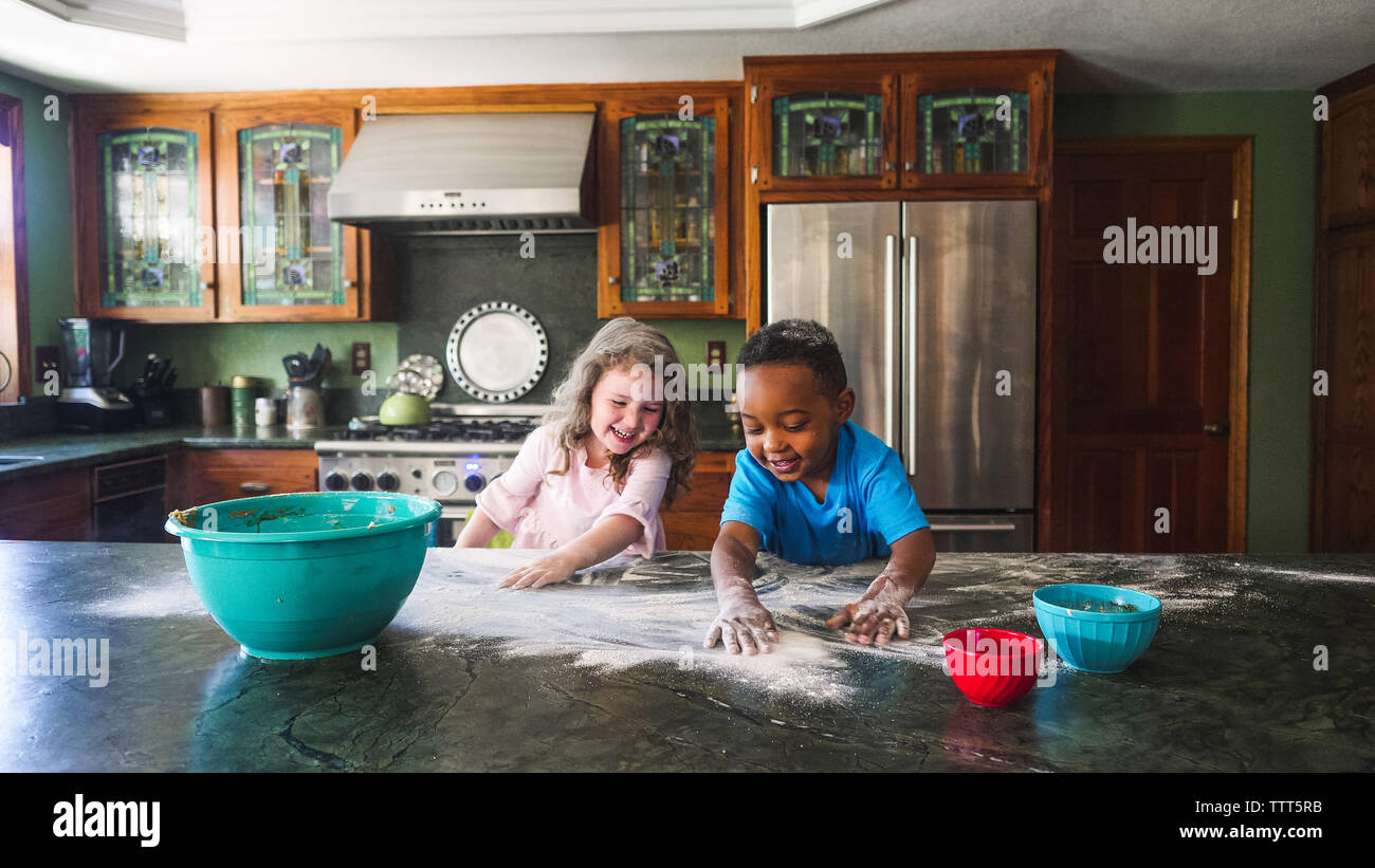 Kids making a mess in the kitchen Stock Photo